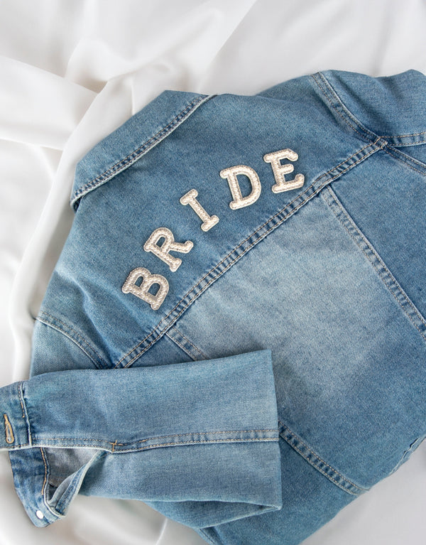 BRIDE iron-on patch on denim jacket