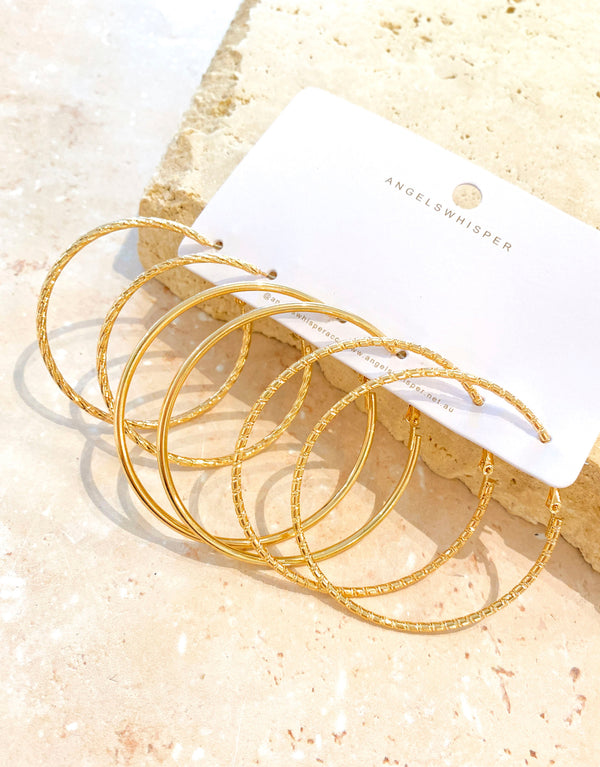 Set of textured gold plated hoop earrings, Crafted from polished zinc alloy.