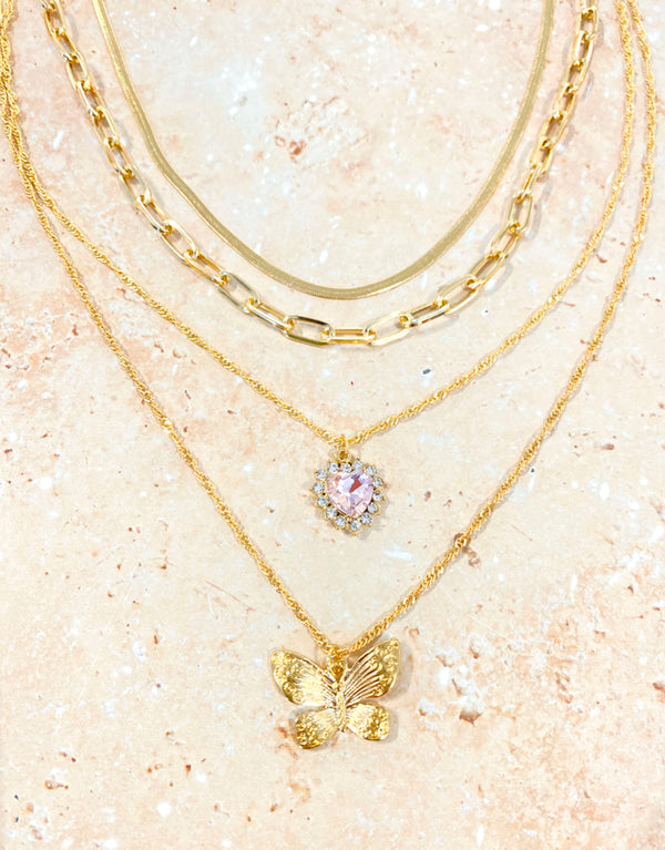 Set of 4 charm necklaces with butterfly and heart designs, Extension chain for customised fit, Crafted from polished zinc alloy.