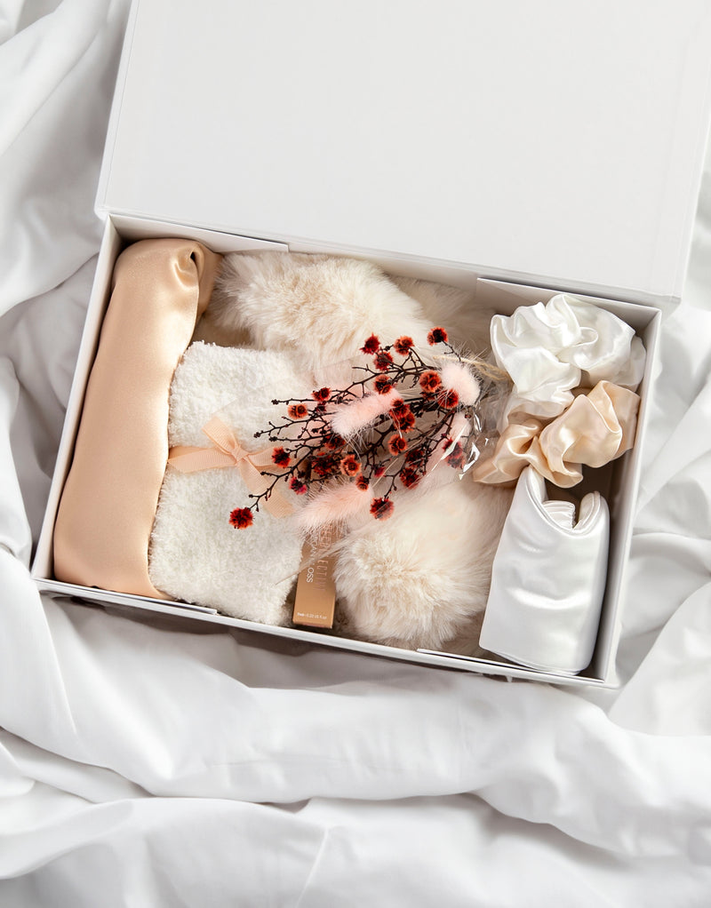 Champagne Satin Dreams Gift Box | Curated Gift Box: Luxe Satin Camisole Set in Champagne (optional personalisation); Ivory Sleep eye mask (optional personalisation); Ivory Fluffy slippers; Pair of ivory fluffy socks; 2 Silky scrunchies; Argan vegan lipstain; Gift box (optional personalisation) and a Small Dried Flowers bouquet.