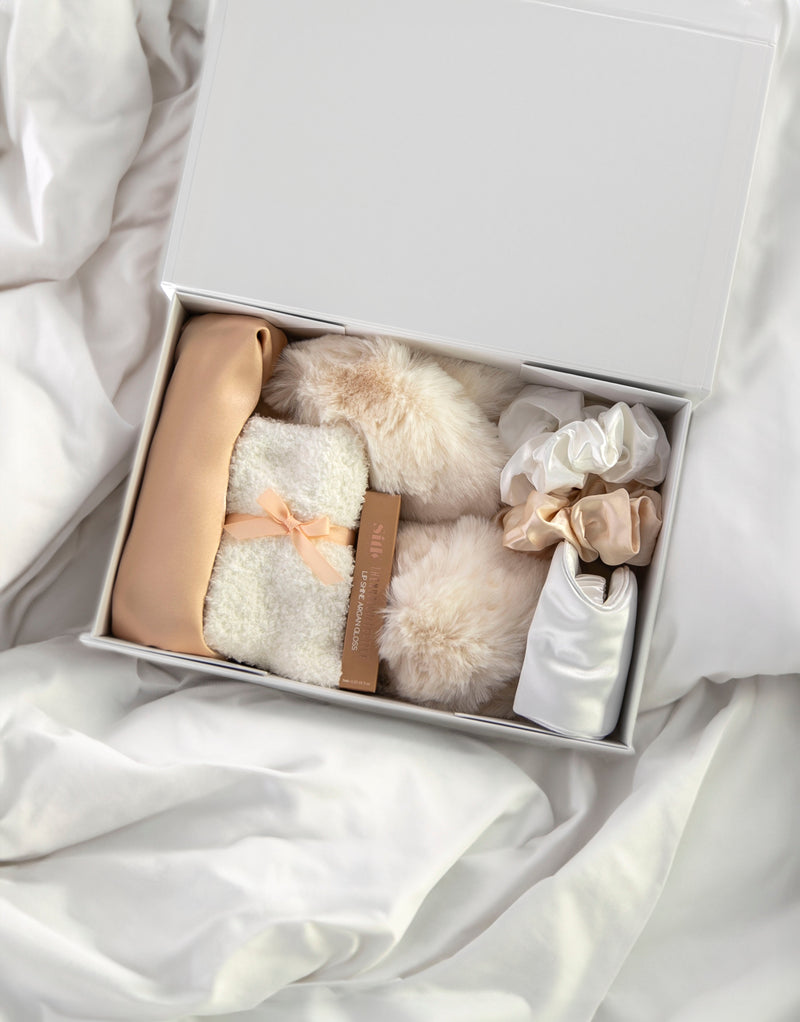Champagne Satin Dreams Gift Box | Curated Gift Box: Luxe Satin Camisole Set in Champagne (optional personalisation); Ivory Sleep eye mask (optional personalisation); Ivory Fluffy slippers; Pair of ivory fluffy socks; 2 Silky scrunchies; Argan vegan lipstain; Gift box (optional personalisation).