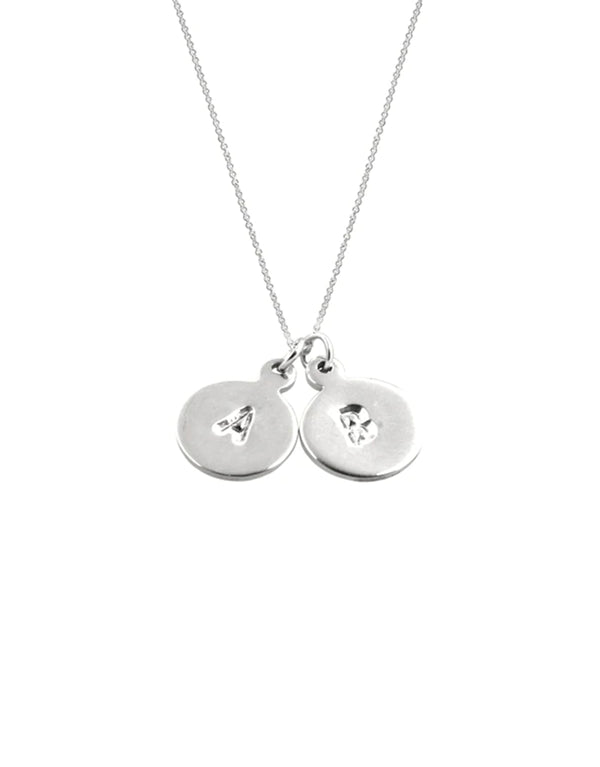Close-up of a sterling silver initials A & B pendant necklace.