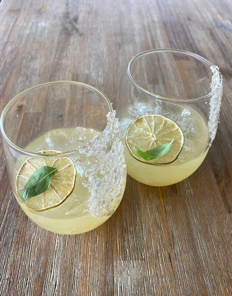 Image of cocktails garnished with dehydrated lime wheels