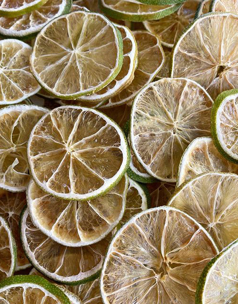 Close-up of loose dehydrated lime wheels showcasing their texture and color