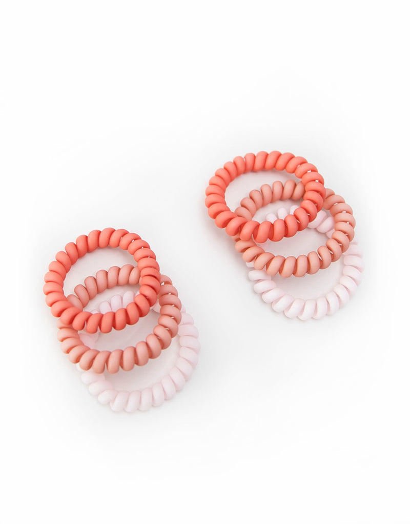 2 packs of 3 hair coils in vibrant fairy floss colors. The hair coils are spiral telephone cord-style hair ties, providing a secure hold without causing damage or kinks to the hair. The coils are 5.5cm in outside diameter.