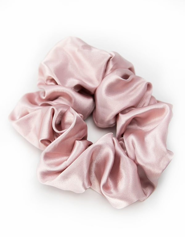 Satin scrunchies in dark blush, soft and silky with a gentle sheen, perfect for adding a touch of elegance to hairstyles.