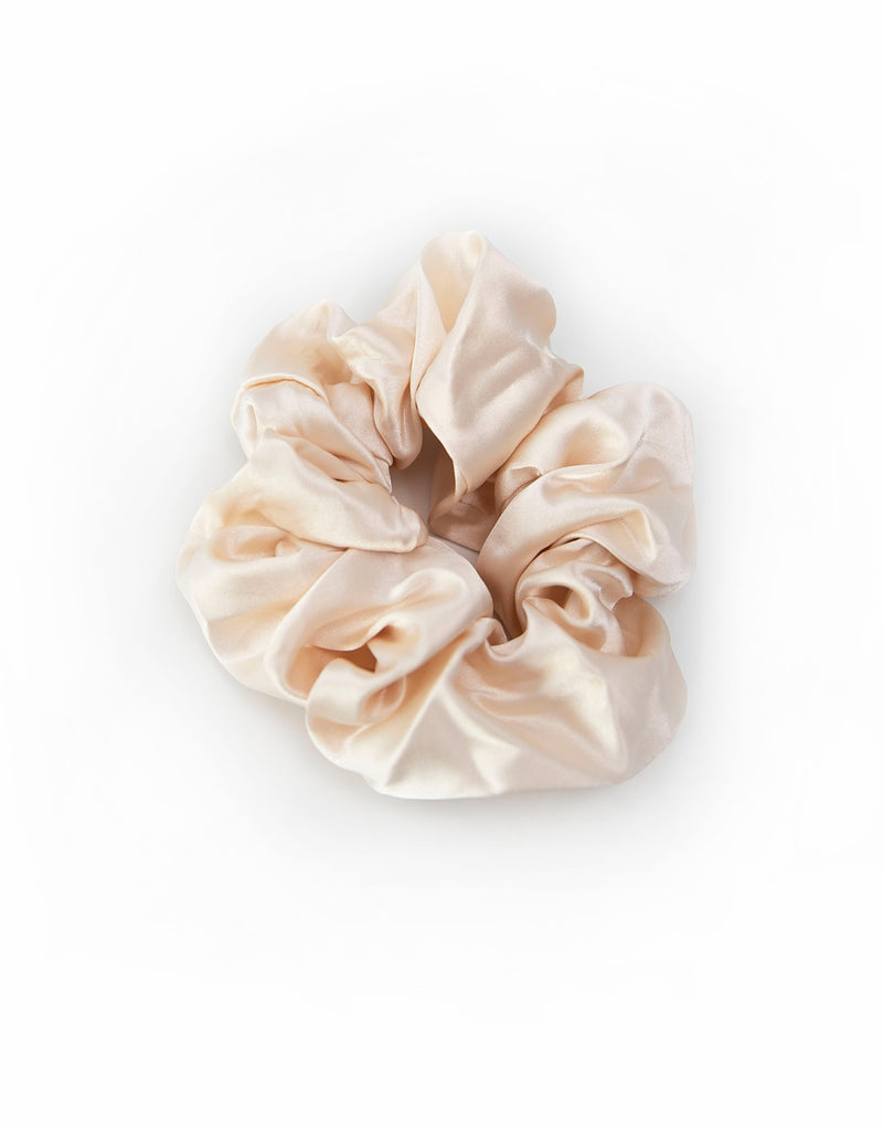 Satin scrunchies in light Champagne, soft and silky with a gentle sheen, perfect for adding a touch of elegance to hairstyles.