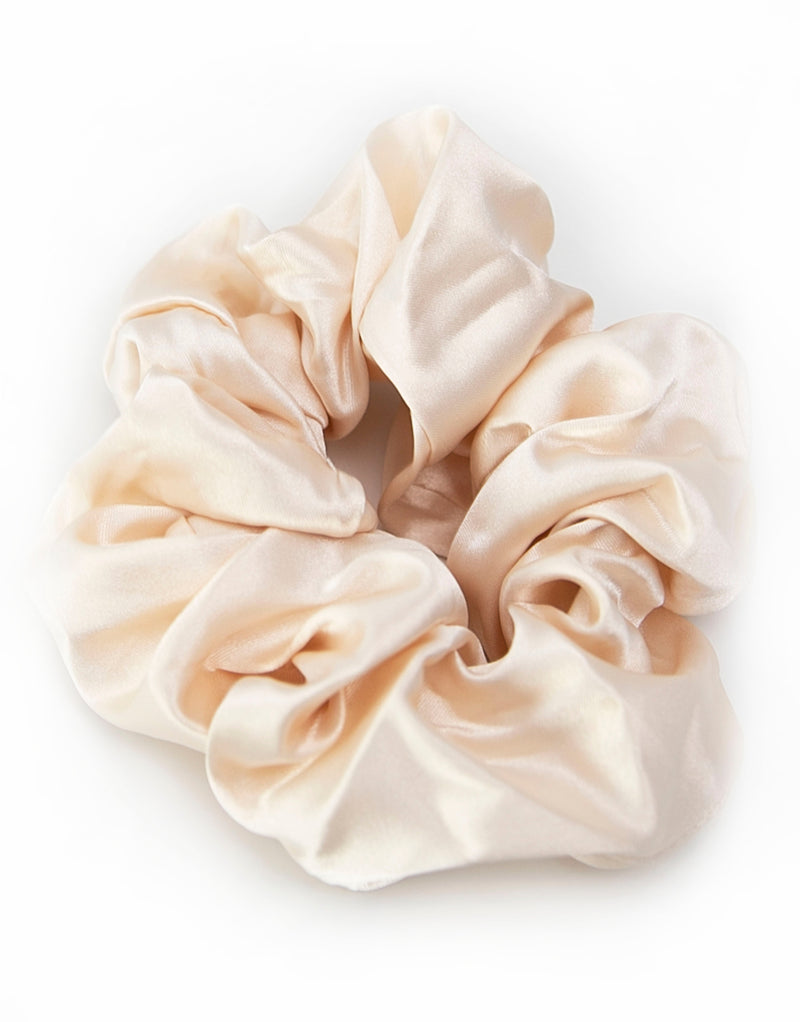 Satin scrunchies in light Champagne, soft and silky with a gentle sheen, perfect for adding a touch of elegance to hairstyles.