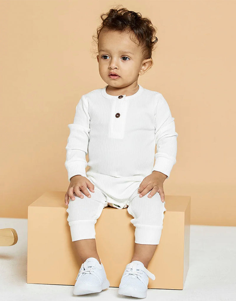 baby wearing 23dreams Knitted Long Sleeve Romper in white