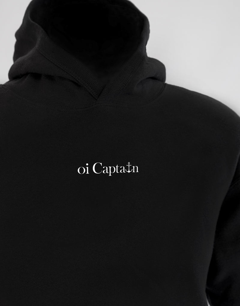 Your weekend just got a little better. Meet the Oi Captain Seas The Day classic fit hoodie.  Created from a cotton blend for instant comfy weekend vibes, crossover hood opening with rib trim applied to edge. Double-needle stitching at shoulder, neck, waistband & cuffs, and a handy kangaroo pocket. Quality vinyl heat pressed Oi Captain logo on front chest and Anchor, latitude and longitude graphic on back.