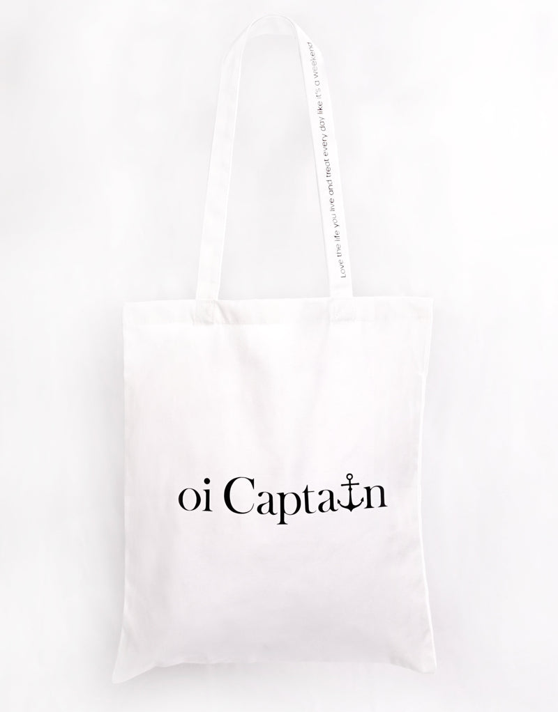 Limited Edition Organic Cotton Canvas Oi Captain Tote Bag is perfect for weekends to everyday.   Quality vinyl heat pressed Oi Captain logo on front and graphic type "Love the life you live and treat everyday like it's a weekend" on handle.  It is your ideal piece to wear any season, durable, sturdy, wonderful and fashionable way to carry things around.